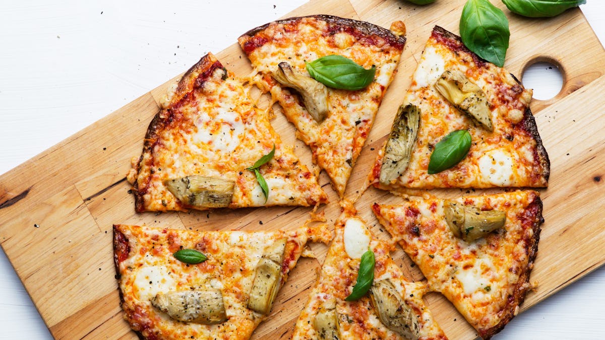 Low-carb cauliflower pizza with artichokes