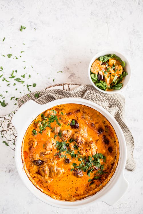 Keto pesto chicken casserole with feta cheese and olives